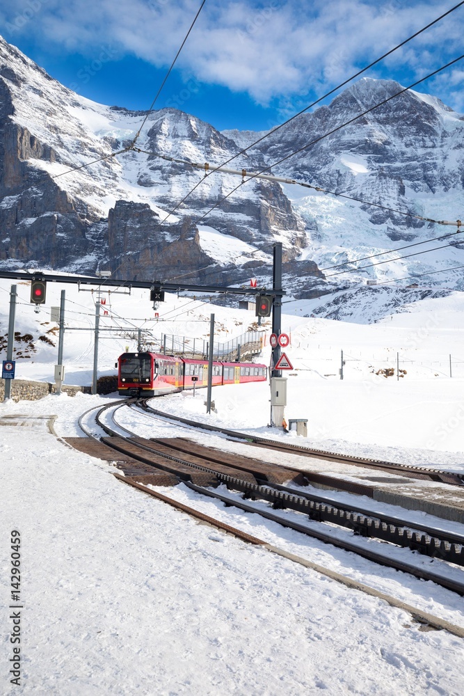 Fototapeta premium Kleine Scheidegg train station under Jungfrau, Monch and Eiger peaks in Swiss Alps, Wengen, Switzerland