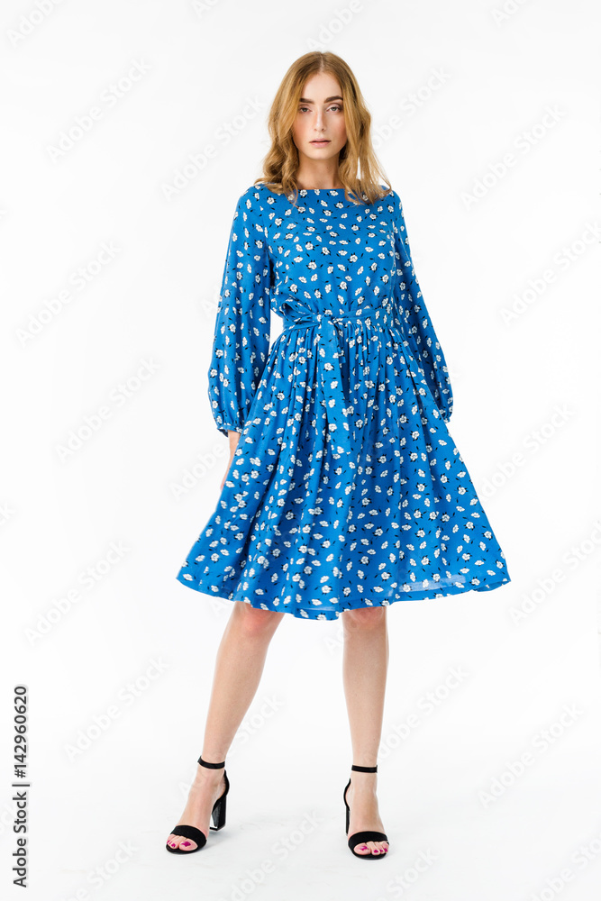 Young elegant female in light summer dress, over white background Young elegant female in light summer dress, over white background