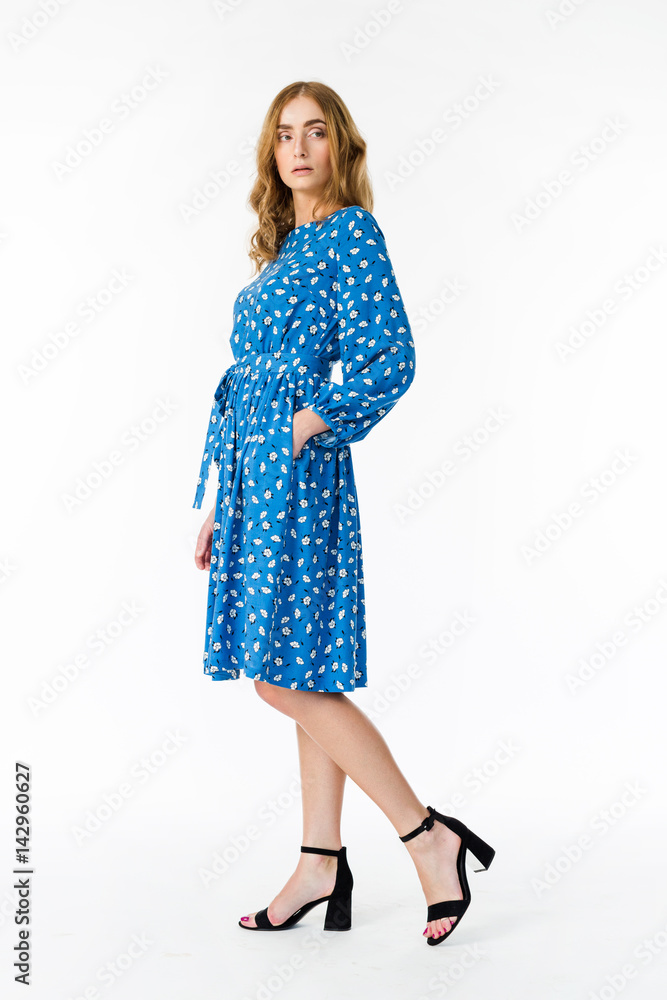 Young elegant female in light summer dress, over white background Young elegant female in light summer dress, over white background