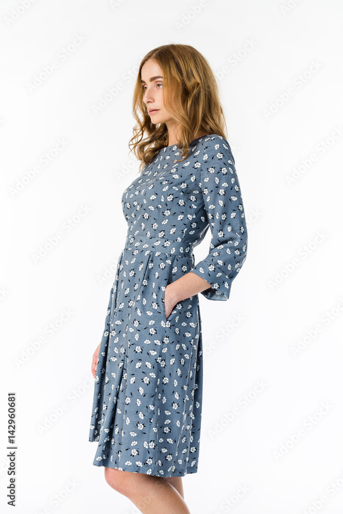 Young elegant female in light summer dress, over white background Young elegant female in light summer dress, over white background