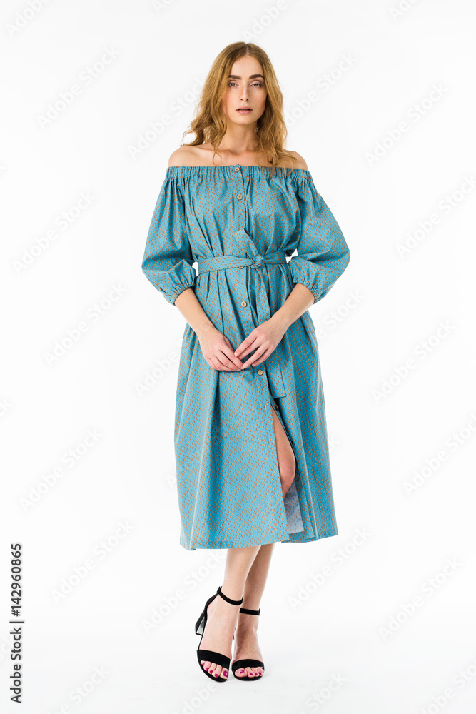 Young elegant female in light summer dress, over white background Young elegant female in light summer dress, over white background