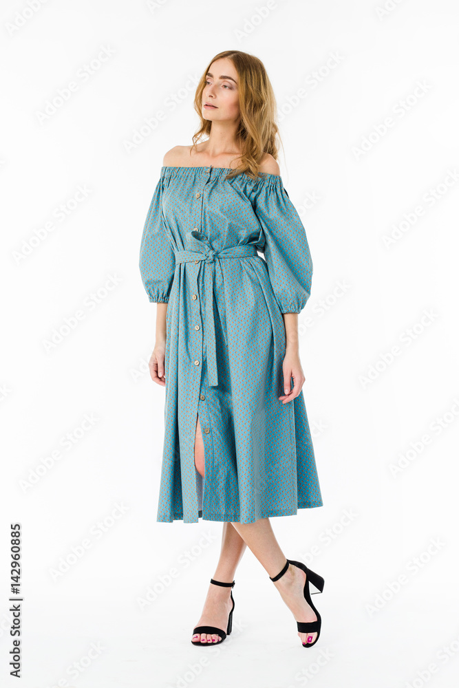 Young elegant female in light summer dress, over white background Young elegant female in light summer dress, over white background