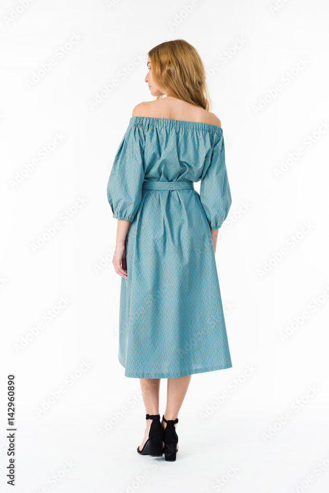 Young elegant female in light summer dress, over white background Young elegant female in light summer dress, over white background