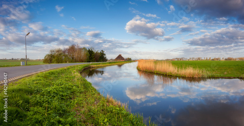 Blue sky with clouds reflec...