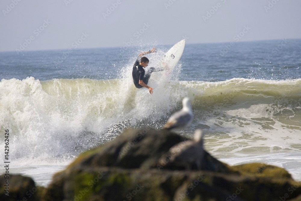 Backlit surfer