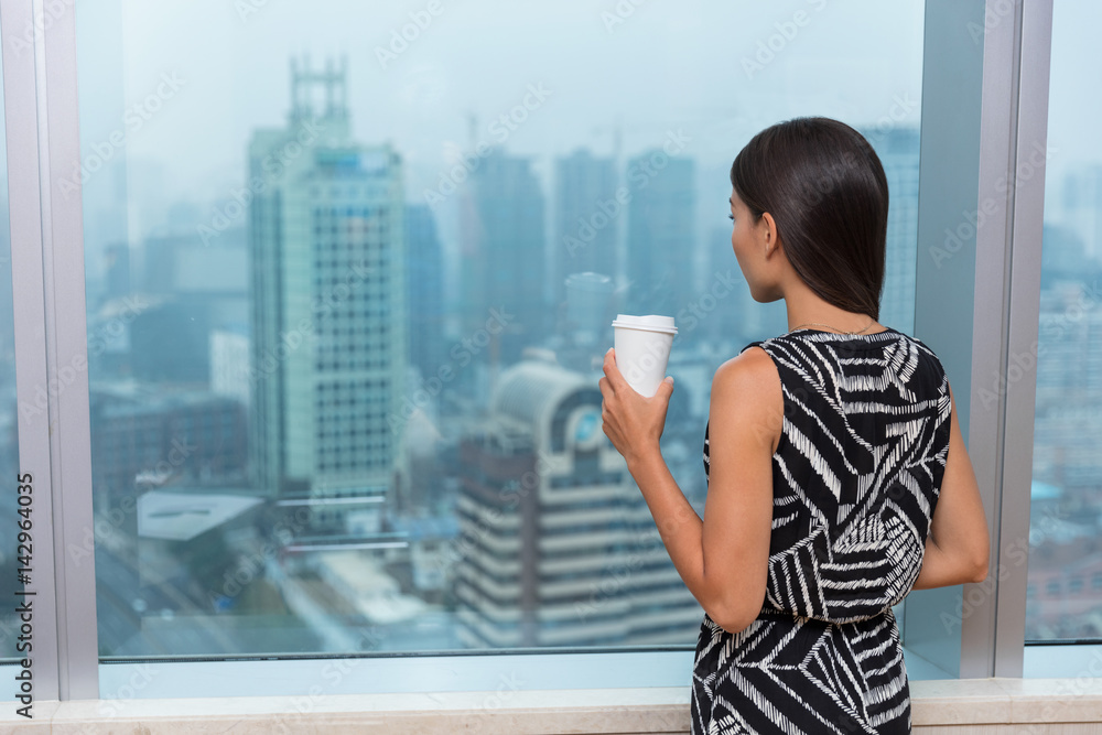 Business woman drinking coffee in office Business woman drinking coffee in office