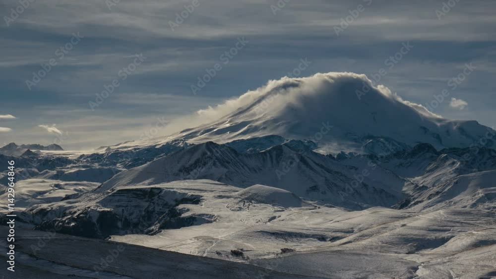 Russia, timelapse. The formation and movement of clouds above the volcano Elbrus in the Caucasus Mountains in winter. Russia, timelapse. The formation and movement of clouds above the volcano Elbrus in the Caucasus Mountains in winter.
