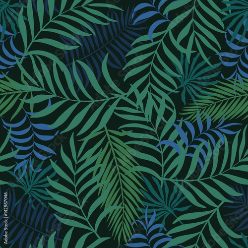 Tropical background with palm leaves. Seamless floral pattern © bell1982