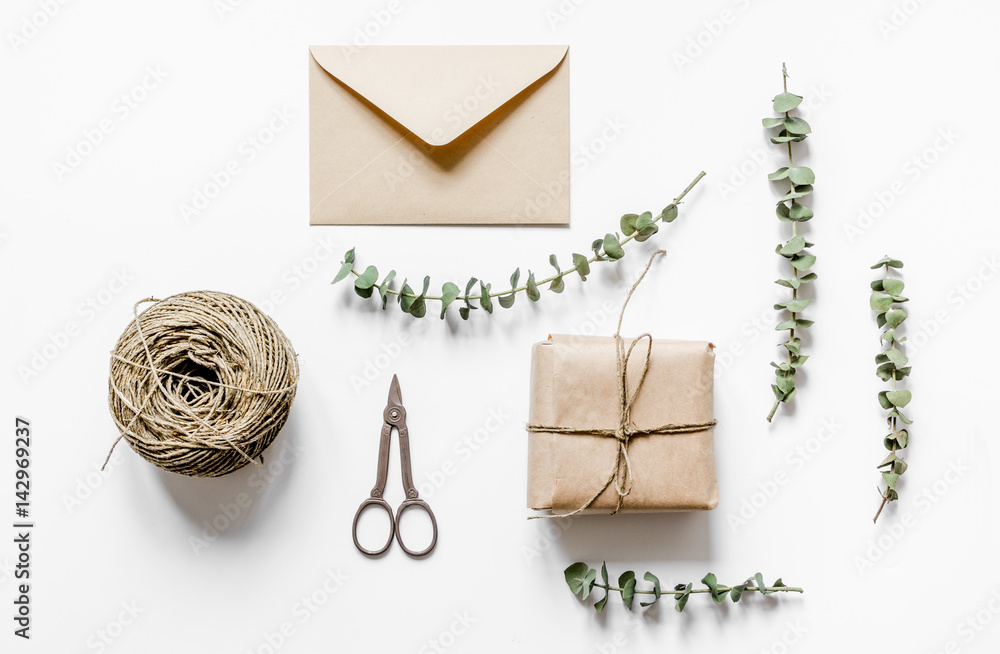 present design in box with flowers on white background top view present design in box with flowers on white background top view