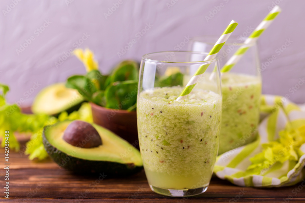 Green smoothie with avocado, spinach and celery. Healthy food Green smoothie with avocado, spinach and celery. Healthy food