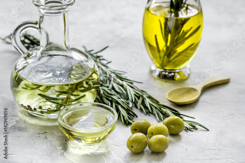 Fototapeta Naklejka Na Ścianę i Meble -  natural oils concept with fresh olives on table background