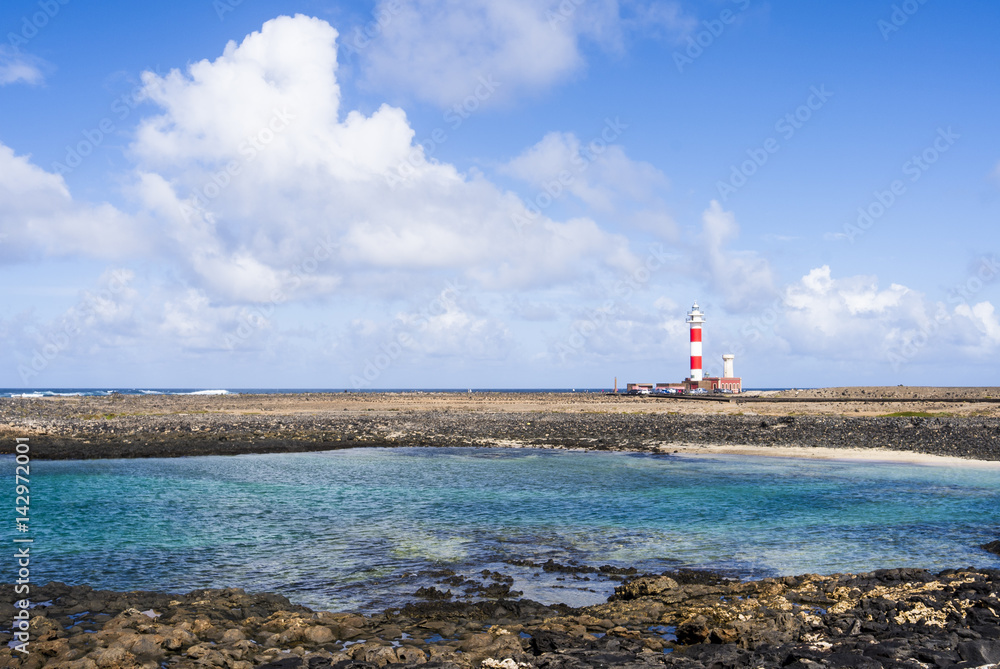 Lighthouse Faro del Tostón at the north cape of Fuerteventura Canary Islands near the village El Cotillo.