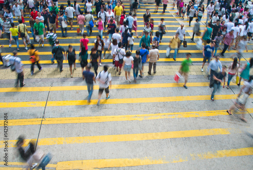 Photography HONGKONG, CHINA - SEPTEMBER 28: Unidentified pedestrians  on zebra crossing street on SEPTEMBER 28, 2013 in Hongkong, China