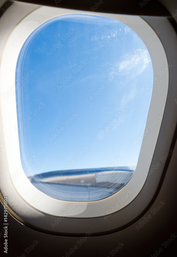 Airplane at fly on the sky, view through aircraft window. Airplane at fly on the sky, view through aircraft window.