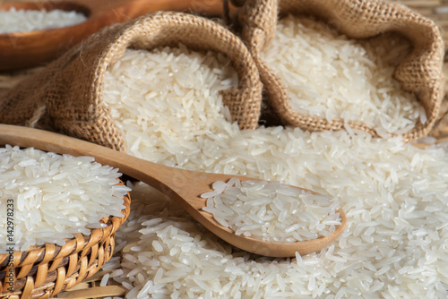 Prepared Jasmine rice with scoop wooden for cooking