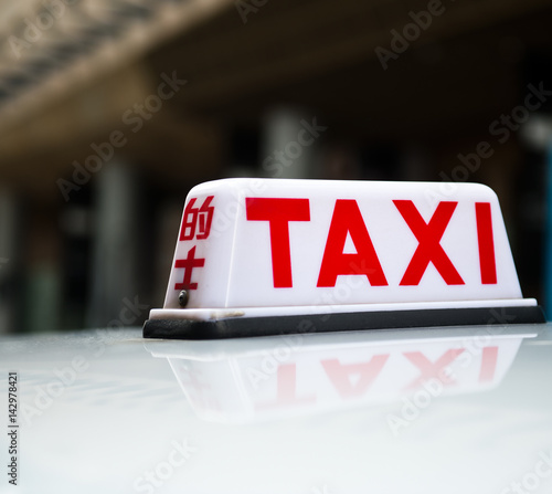 Taxi sign on the street, Hong Kong. selective focus photo