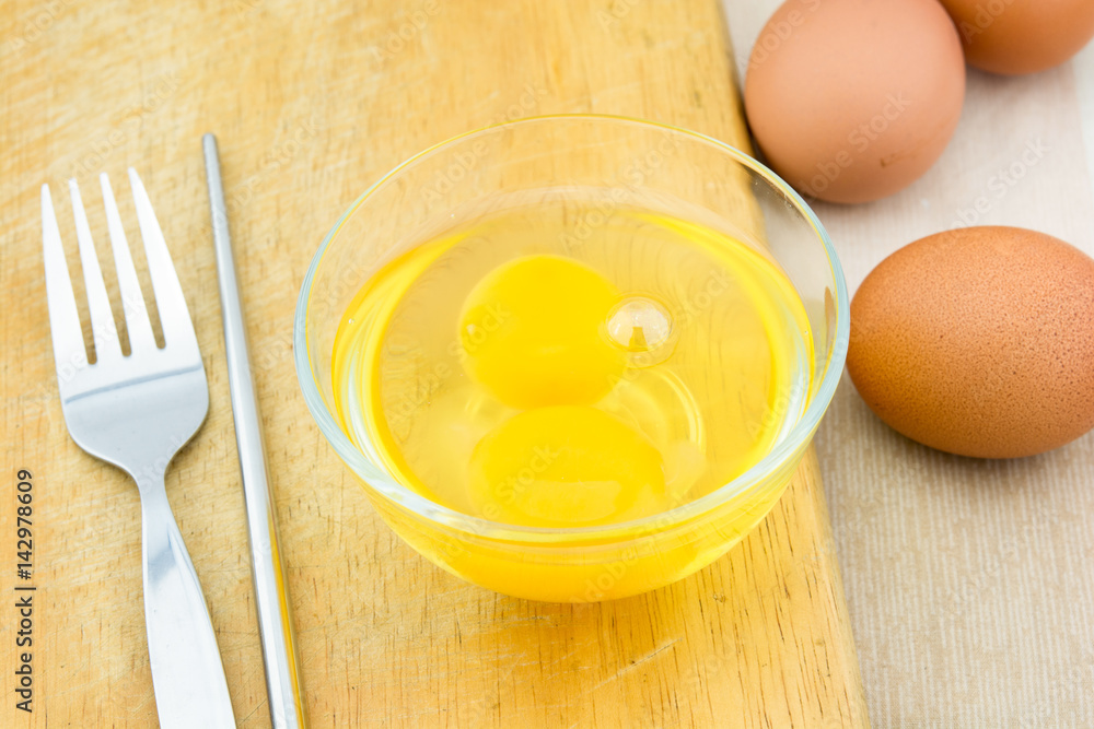 eggs yolk on the bowl ready to cook. eggs yolk on the bowl ready to cook.