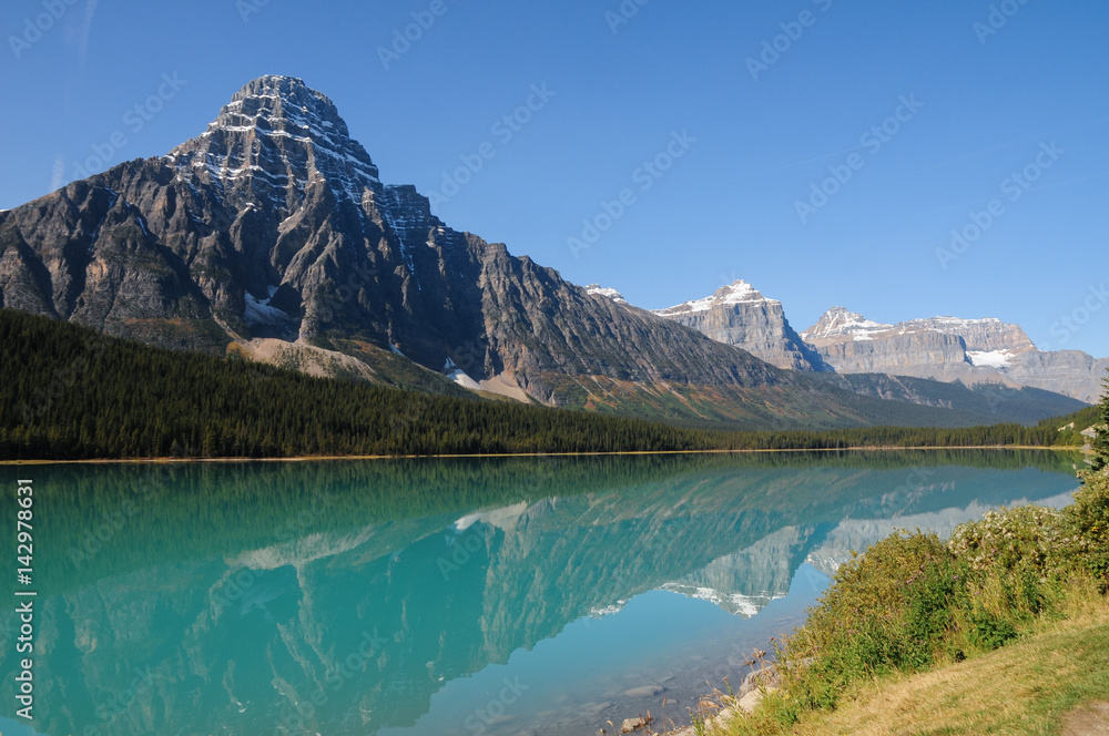 Rocky Mountains reflecting in Waterfowl Lake, Alberta, Canada. Icefields Parkway, Banff National Park.