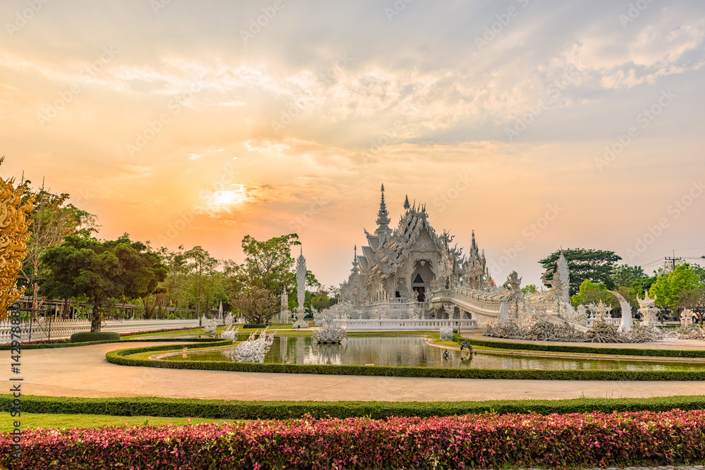Wat Rong Khun()at sunset in Chiang Rai,Thailand.03/04/2017 Wat Rong Khun is modern building, well known worldwide.It was  designed by  Chalermchai Kositpipat.
