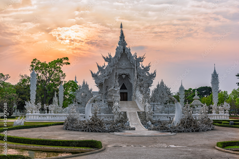 Wat Rong Khun()at sunset in Chiang Rai,Thailand.03/04/2017 Wat Rong Khun is modern building, well known worldwide.It was  designed by  Chalermchai Kositpipat.