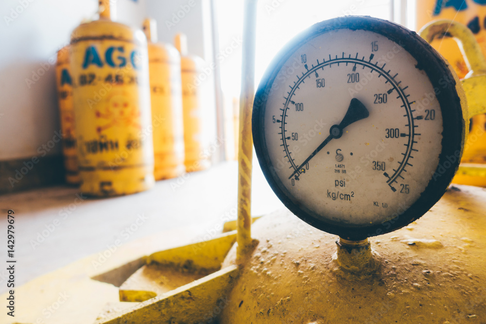 pressure gauges and valves of chlorine gas cylinders Stock Photo