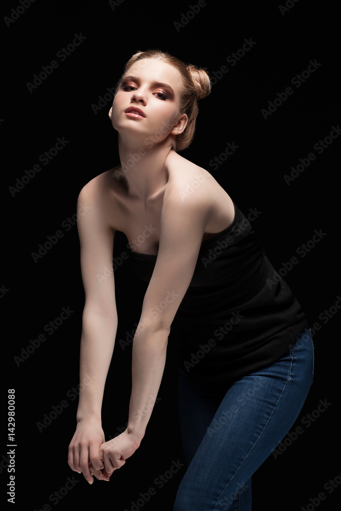 Young teen female beauty low key portrait with day makeup on black Young teen female beauty low key portrait with day makeup on black