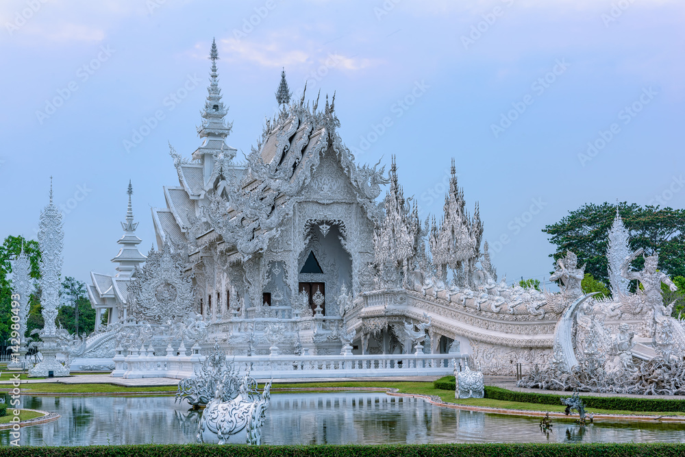 Wat Rong Khun()at sunset in Chiang Rai,Thailand.03/04/2017 Wat Rong Khun is modern building, well known worldwide.It was  designed by  Chalermchai Kositpipat.