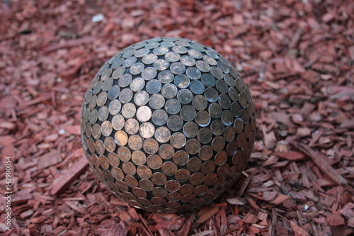 Sphere covered in old pennies