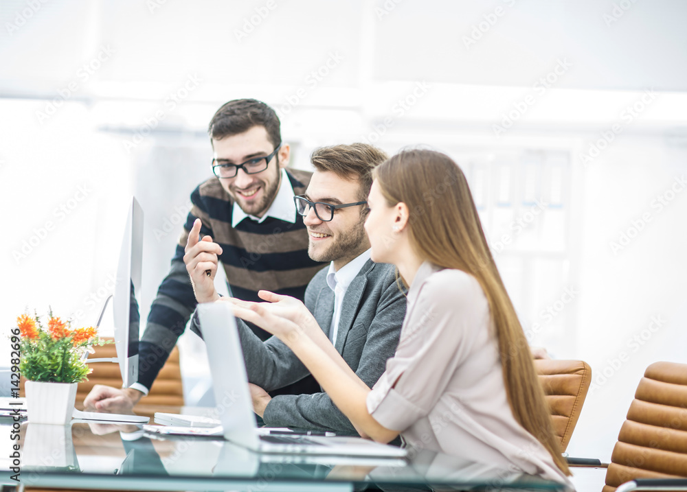 Fototapeta premium professional business team is developing a new project ,sitting behind a Desk in a modern office.