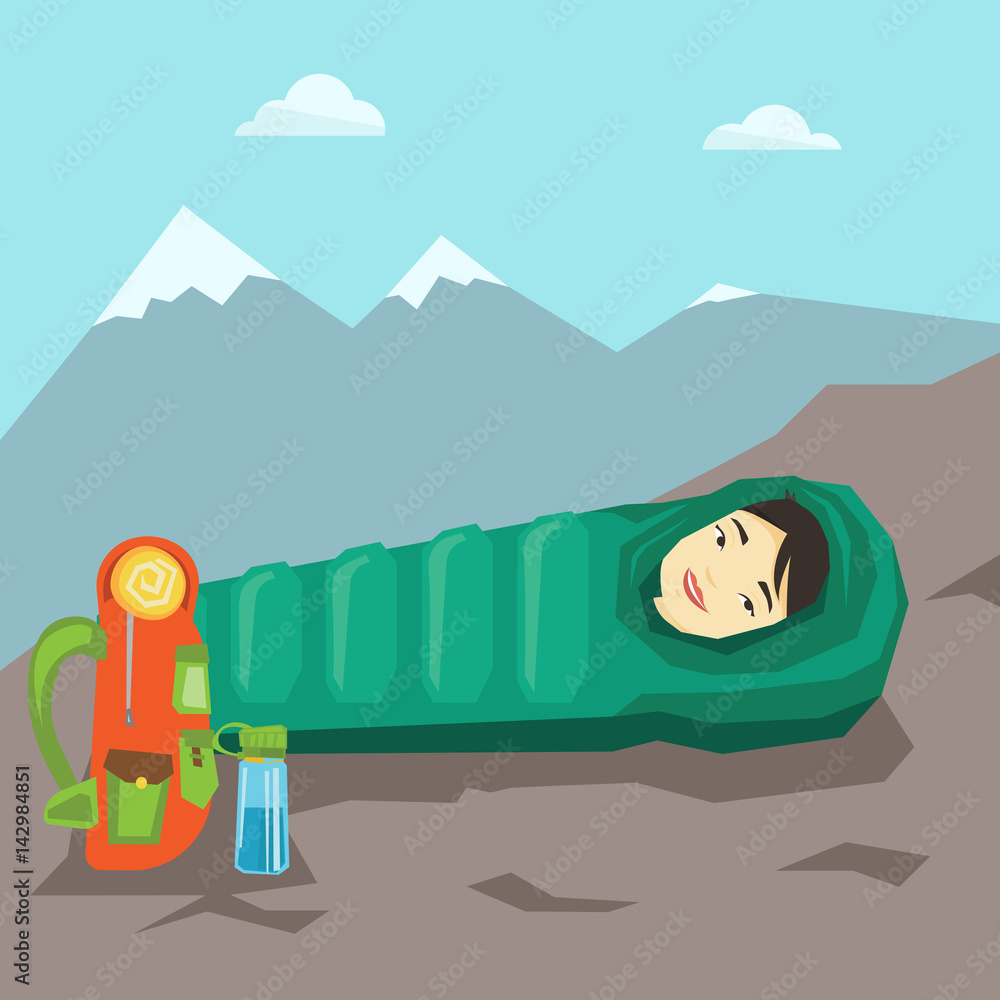 Woman sleeping in sleeping bag in the mountains.