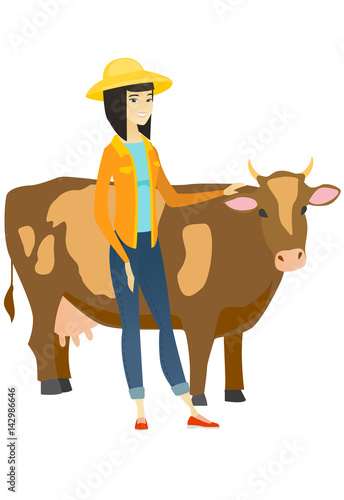 Farmer standing with crossed arms near cow.