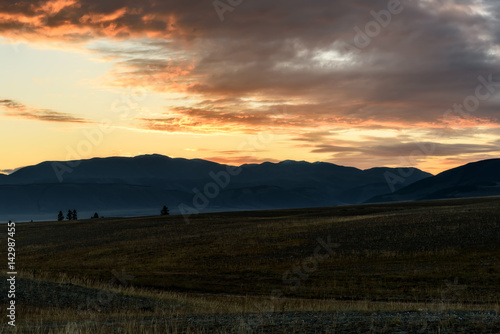 mountains steppe tree clouds sunset