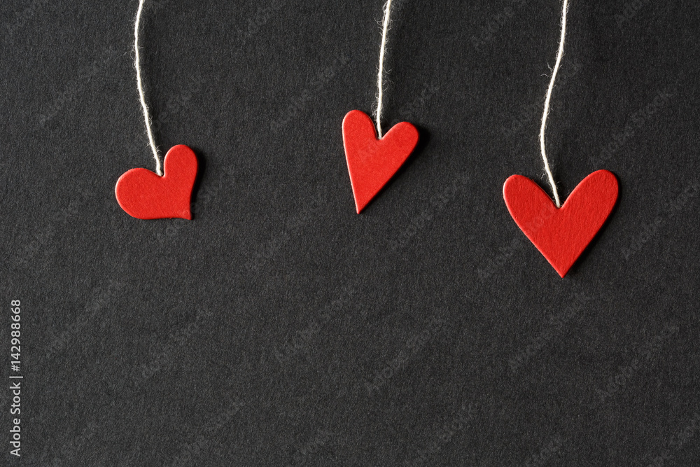 Handmade small paper hearts with strings Handmade small paper hearts with strings