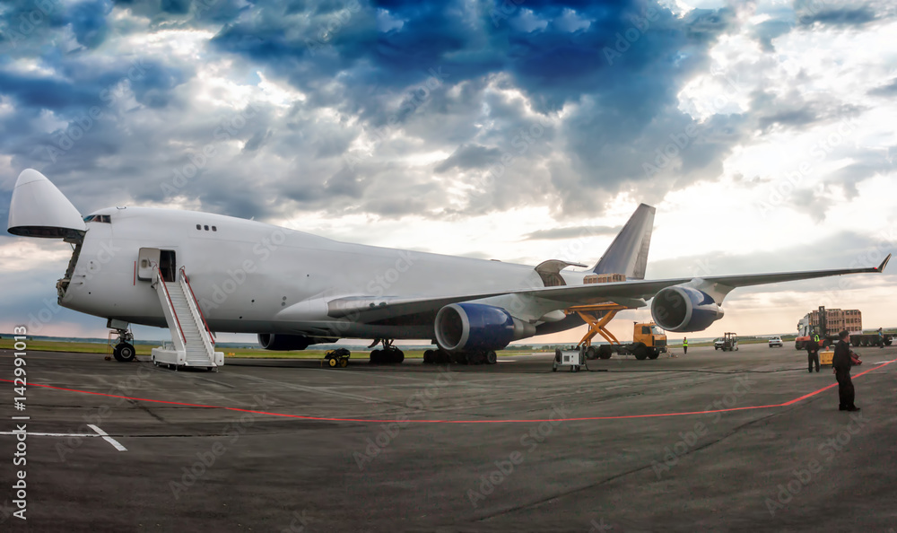 Unloading wide body cargo airplane Unloading wide body cargo airplane