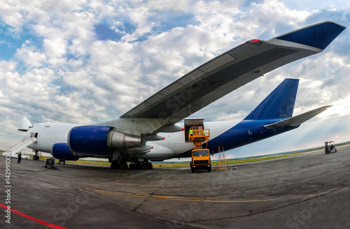 Unloading wide body cargo airplane
