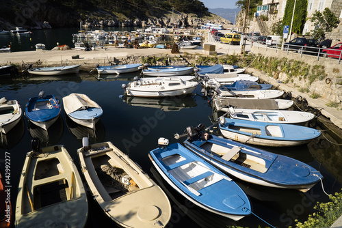 Small boats in European city harbor