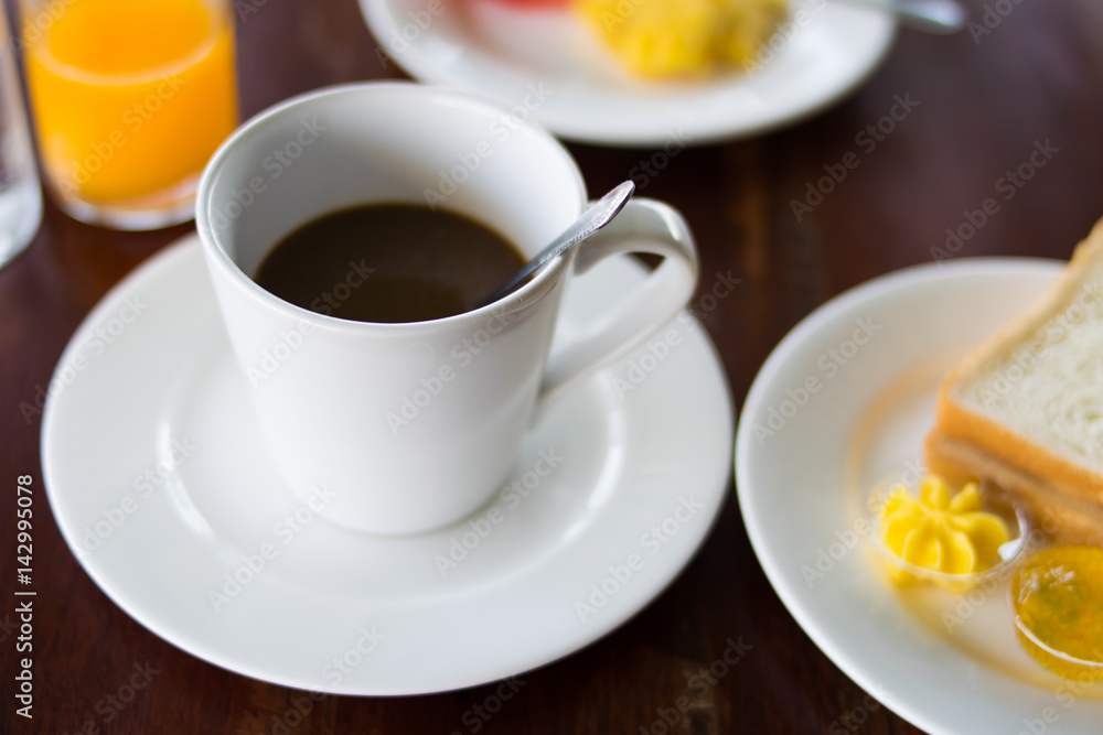coffee and breakfast set on wooden table coffee and breakfast set on wooden table