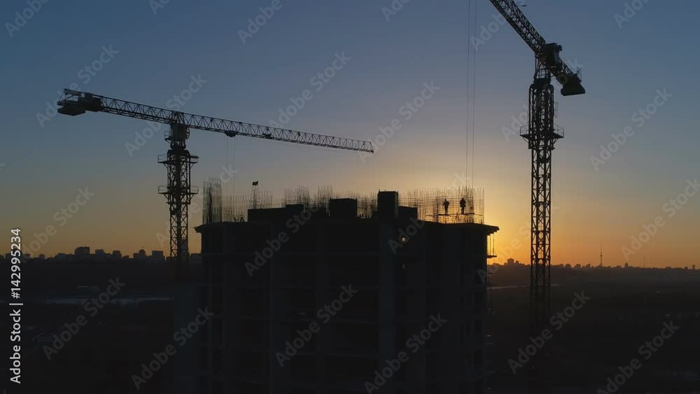 Construction site at sunset. Aerial shot Construction site at sunset. Aerial shot