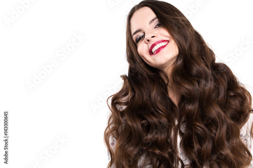 Beautiful woman with long curly hair isolated.