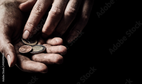 Hands of beggar with few coins © Nik_Merkulov