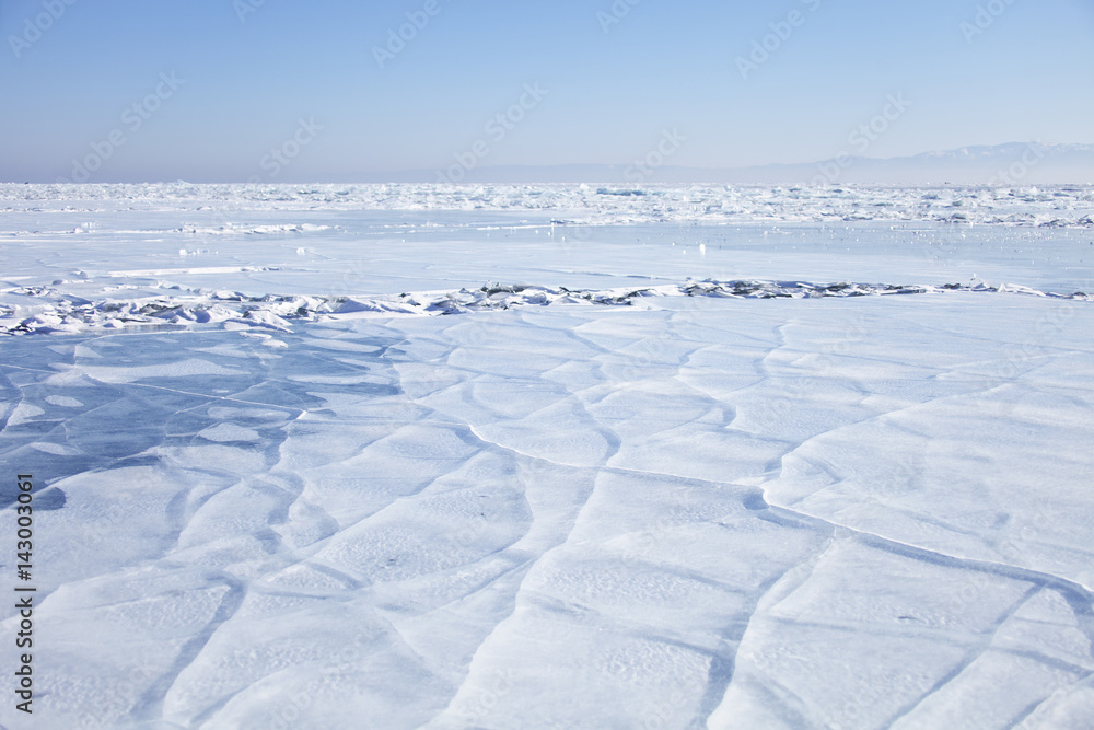 Lake Baikal, cracks in ice. Winter landscape
