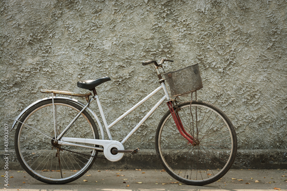 Old bicycle vintage with wall backdrop concrete