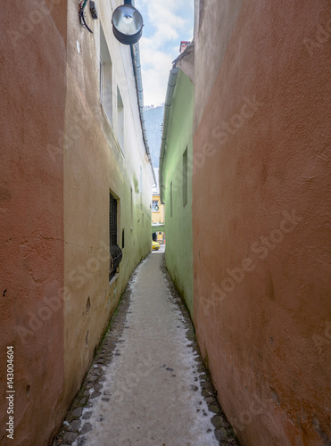 Strada Sforii (Rope Street) is the narrowest street in Brasov, Romania, and one of the narrowest in the whole Europe, with a width between 111 and 135 centimeters  photo