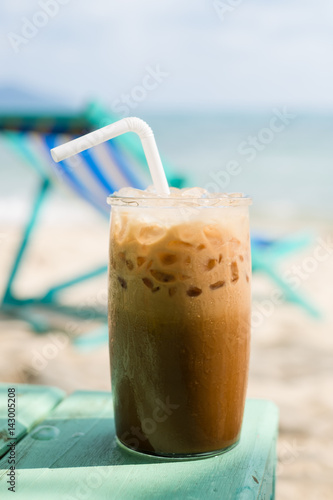 Enjoying an iced coffee on the beach