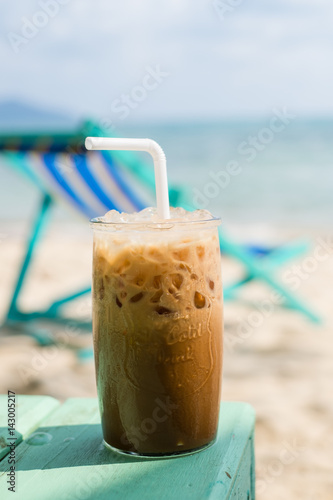 Enjoying an iced coffee on the beach