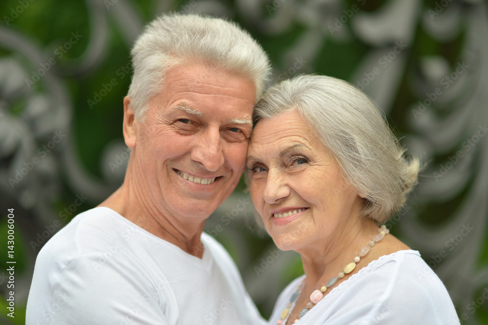 Happy elderly couple embracing