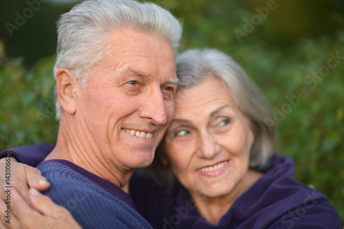 Happy elderly couple embracing