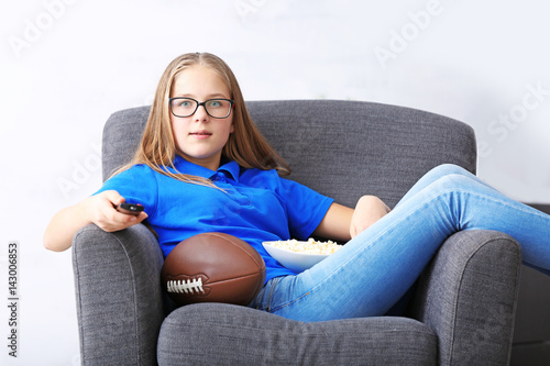 Pretty teenager watching ru...