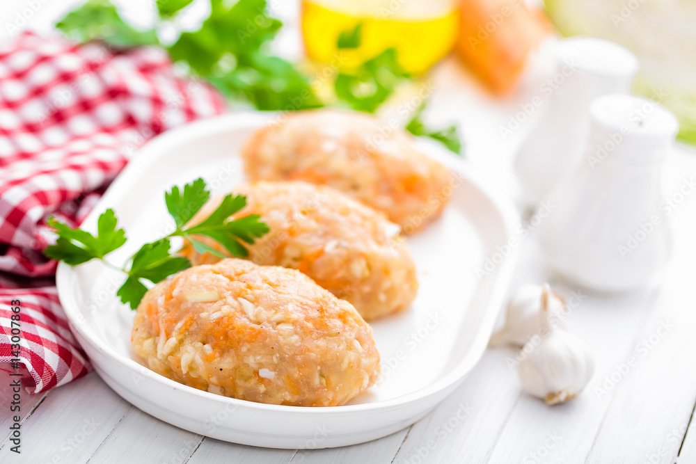 Raw, uncooked meat cutlets with vegetables, baby food