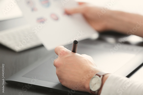 Male hands using graphics t...
